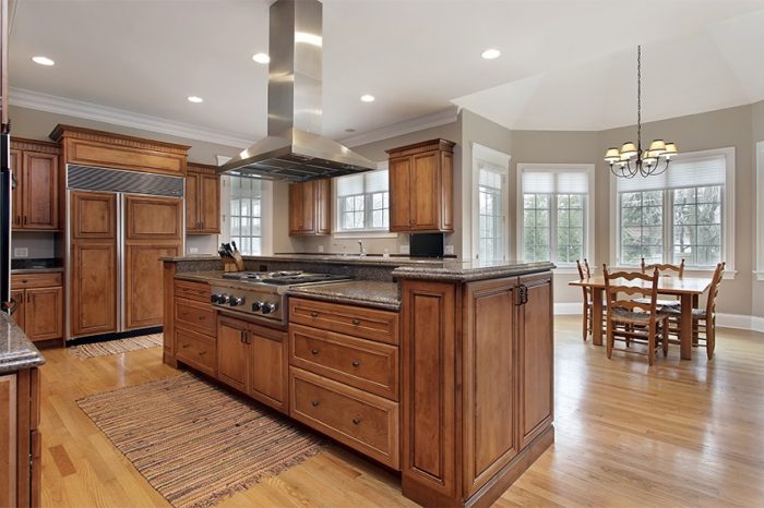 Kitchen in luxury home with wood and granite island